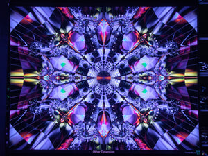 Mandala design with vibrant UV colors and geometric patterns on a dark background